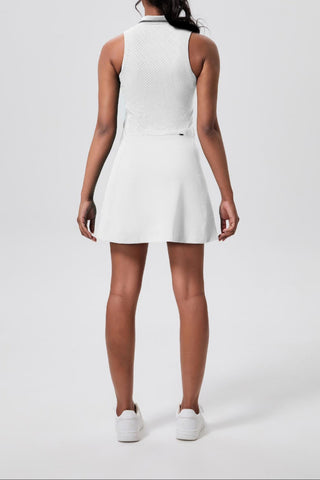 White sleeveless dress worn by a person on a white background